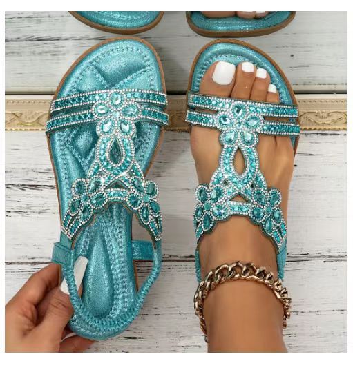 Grå metallic sandal med sølv rhinsten blomsterrem, set oppefra og på fod — Venzelo