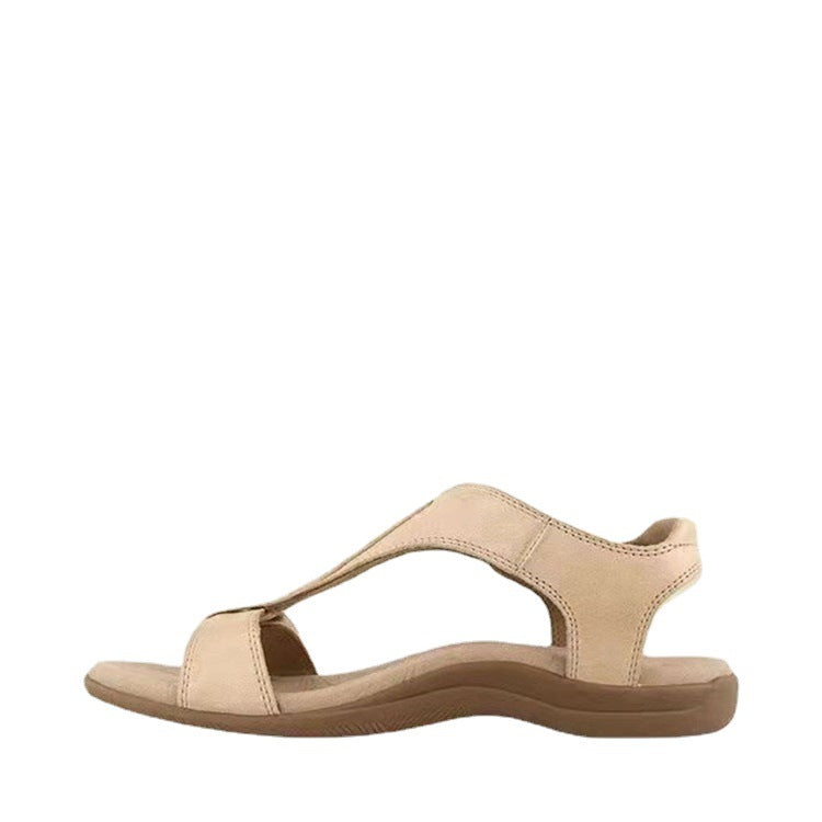 Marineblå sandal liggende på vægt, nærbillede der viser sål og velcro-detalje — Venzelo